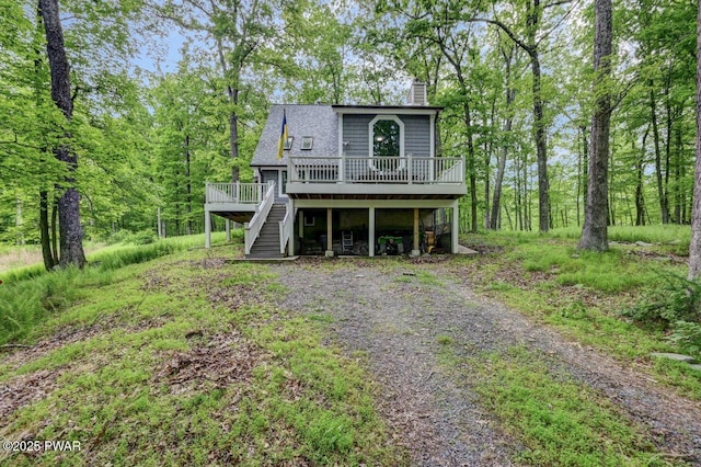 143 E Lakeview Rd, Lackawaxen, PA 18435 - view of front of house with a deck, a chimney, and stairs