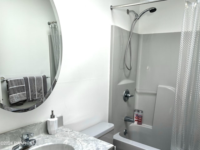 full bathroom with toilet, shower / bathtub combination with curtain, and sink