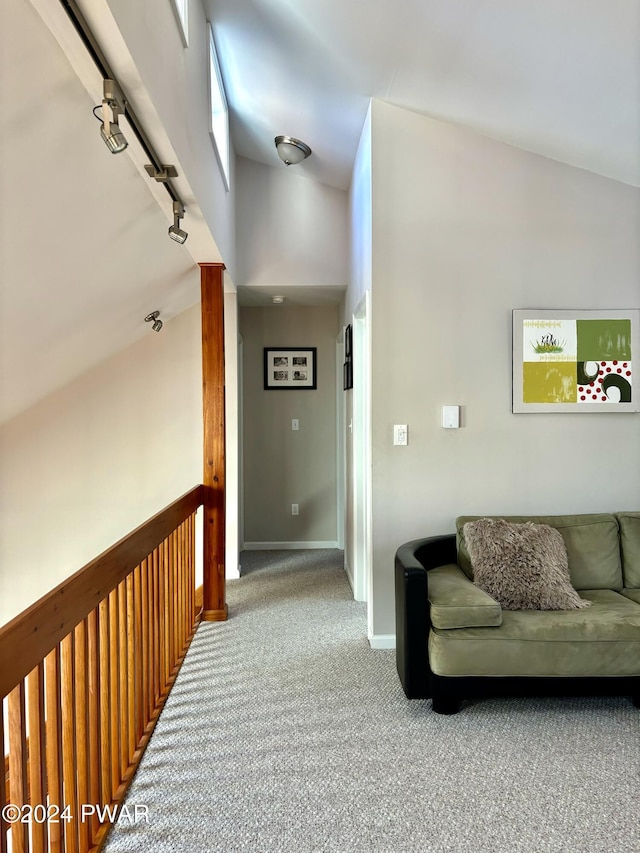 hall with carpet and rail lighting