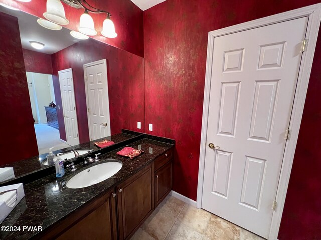 bathroom featuring tile patterned flooring and vanity