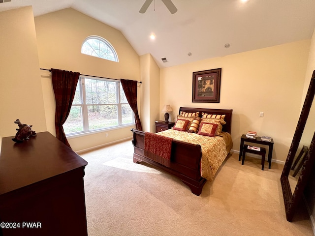 bedroom featuring multiple windows, ceiling fan, light carpet, and lofted ceiling