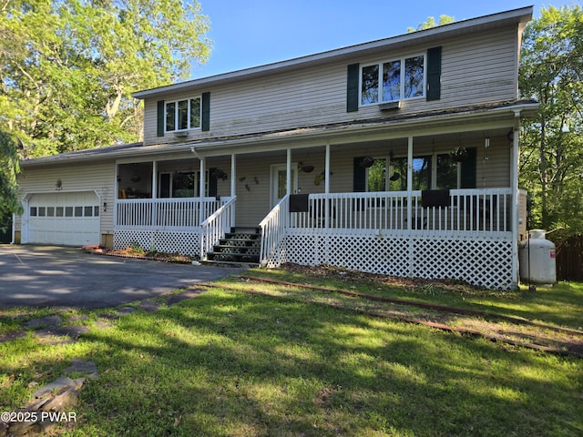 129 Hawk View Dr, Milford, PA 18337 - view of front of property featuring a garage, covered porch, asphalt driveway, and a front yard