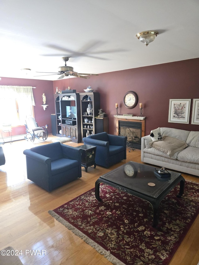 129 Hawk View Dr, Milford, PA 18337 - living room with wood finished floors, a ceiling fan, and a fireplace