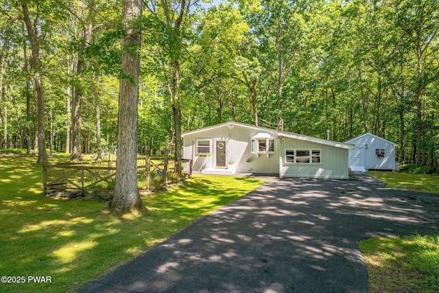 201 Oak Hill Rd, Hawley, PA 18428 - view of front of property featuring driveway, a front lawn, a view of trees, and an outdoor structure