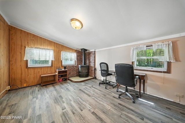 201 Oak Hill Rd, Hawley, PA 18428 - office area featuring a wood stove, wood finished floors, lofted ceiling, wooden walls, and crown molding