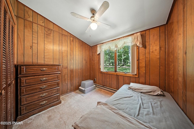 201 Oak Hill Rd, Hawley, PA 18428 - bedroom featuring light carpet, wooden walls, vaulted ceiling, a baseboard radiator, and ceiling fan