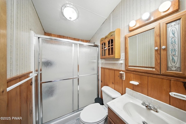 201 Oak Hill Rd, Hawley, PA 18428 - bathroom featuring wallpapered walls, a shower stall, and vanity