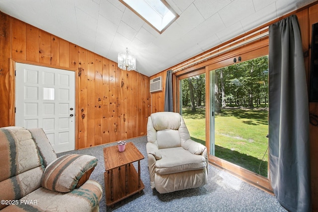 201 Oak Hill Rd, Hawley, PA 18428 - sitting room with a chandelier, carpet floors, wood walls, an AC wall unit, and lofted ceiling