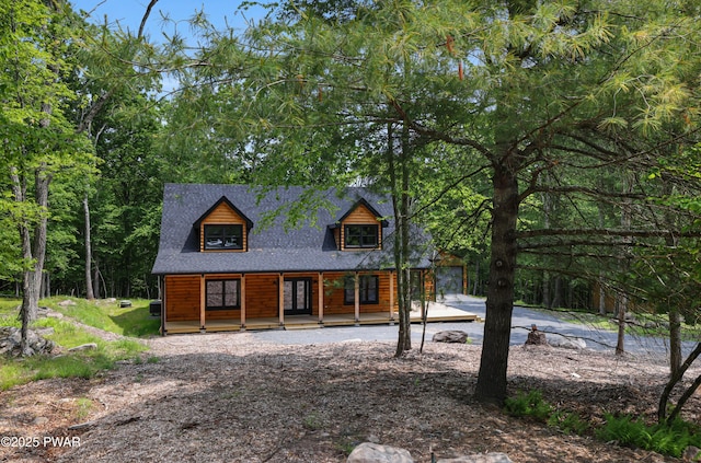 rustic home featuring covered porch