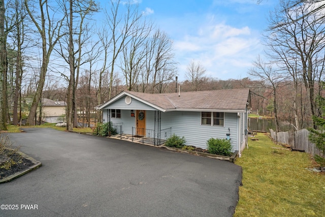 135 Outer Dr, Dingmans Ferry, PA 18328 - view of front of home with covered porch, roof with shingles, and asphalt driveway