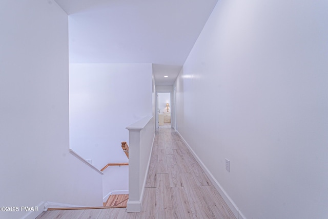 corridor featuring light hardwood / wood-style flooring