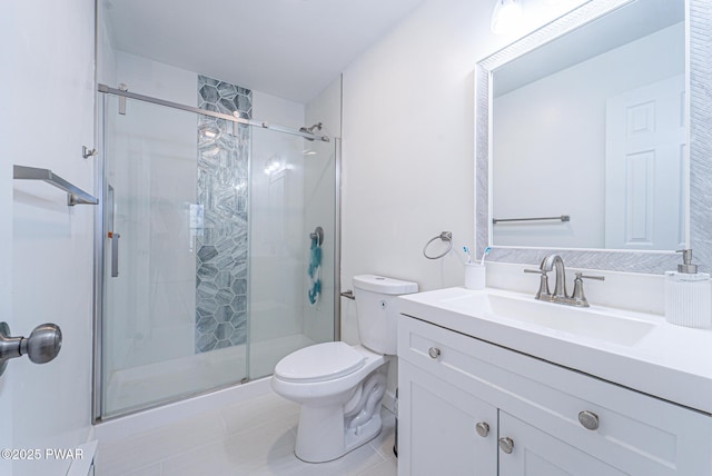 bathroom with vanity, tile patterned flooring, a shower with shower door, and toilet