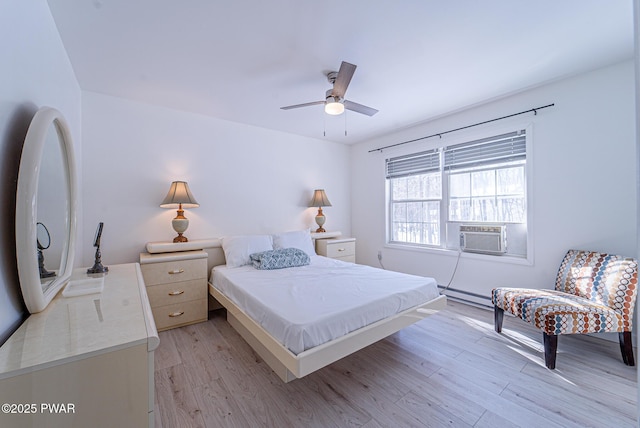 bedroom with cooling unit, ceiling fan, baseboard heating, and light wood-type flooring