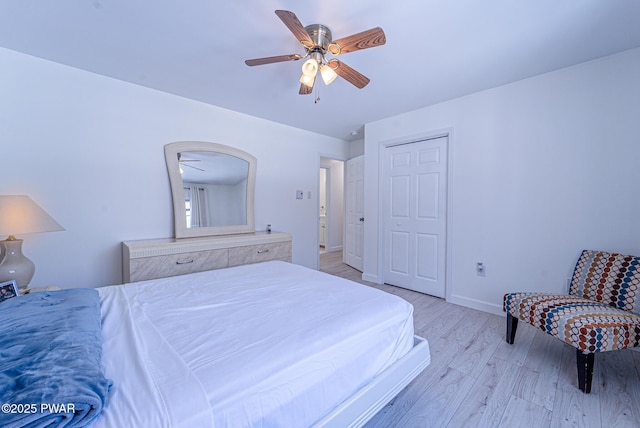 bedroom with ceiling fan and light wood-type flooring