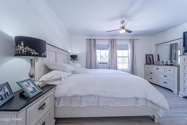 bedroom with hardwood / wood-style flooring and ceiling fan