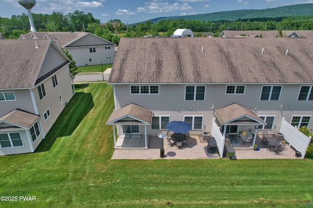 233 Shadow Wood Cir, Archbald, PA 18403 - back of house with a patio, a mountain view, a fenced backyard, and a residential view