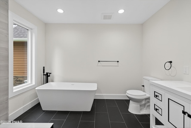 120 Milford Estates Dr, Milford, PA 18337 - bathroom with a freestanding bath, healthy amount of natural light, vanity, tile patterned flooring, and recessed lighting
