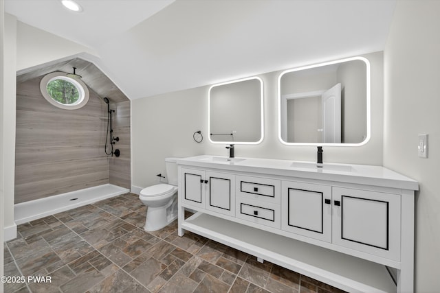 120 Milford Estates Dr, Milford, PA 18337 - full bath featuring lofted ceiling, tiled shower, double vanity, and stone finish floors