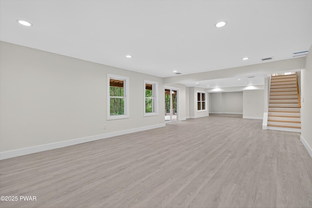 120 Milford Estates Dr, Milford, PA 18337 - unfurnished living room featuring stairway, light wood-style floors, and recessed lighting