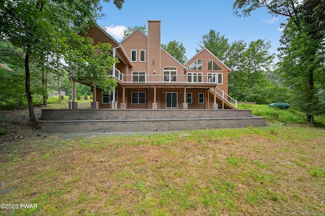 120 Milford Estates Dr, Milford, PA 18337 - rear view of property featuring a wooden deck, stairway, and a chimney