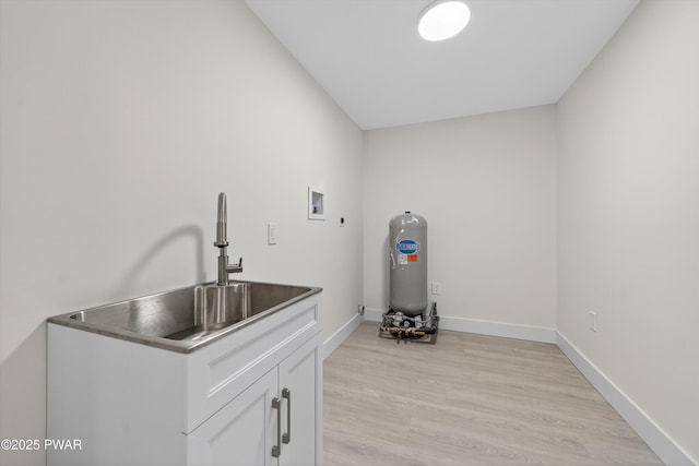 120 Milford Estates Dr, Milford, PA 18337 - laundry room featuring light wood finished floors, hookup for a washing machine, cabinet space, and electric dryer hookup