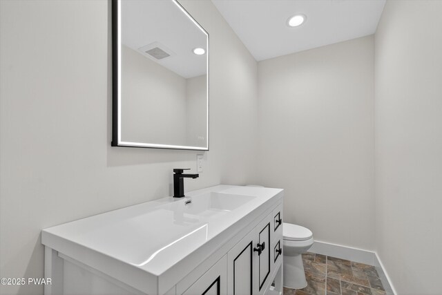 120 Milford Estates Dr, Milford, PA 18337 - bathroom featuring stone finish flooring, vanity, and recessed lighting