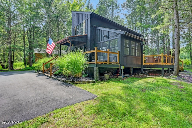 803 Deerfield Rd, Lake Ariel, PA 18436 - view of home's exterior with a sunroom, a yard, and a deck