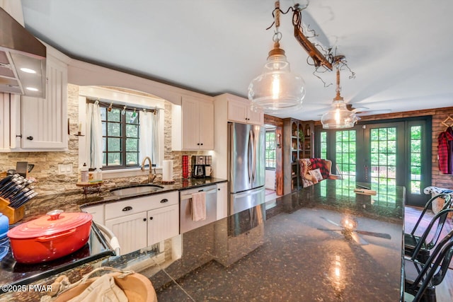 803 Deerfield Rd, Lake Ariel, PA 18436 - kitchen featuring stainless steel appliances, healthy amount of natural light, french doors, and wall chimney range hood