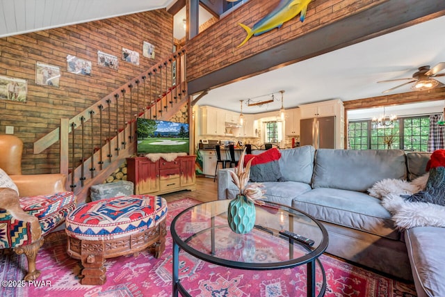 803 Deerfield Rd, Lake Ariel, PA 18436 - living area featuring a chandelier, stairs, light wood-type flooring, ceiling fan, and wooden walls