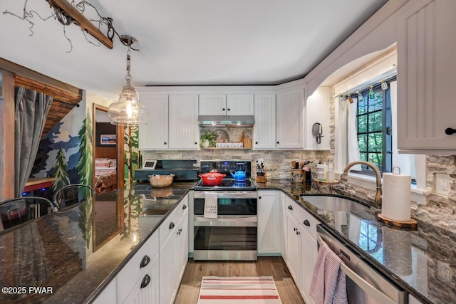 803 Deerfield Rd, Lake Ariel, PA 18436 - kitchen with appliances with stainless steel finishes, white cabinets, light wood-style flooring, backsplash, and under cabinet range hood