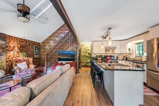 803 Deerfield Rd, Lake Ariel, PA 18436 - kitchen with freestanding refrigerator, open floor plan, light wood-style floors, ceiling fan, and range