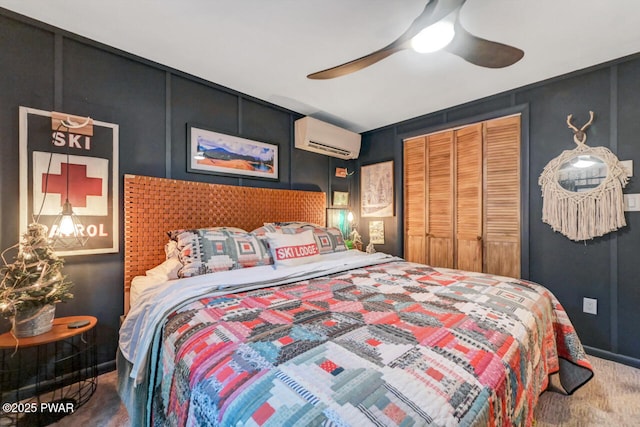 803 Deerfield Rd, Lake Ariel, PA 18436 - bedroom with a wall mounted AC, carpet, a closet, a decorative wall, and ceiling fan