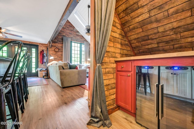 803 Deerfield Rd, Lake Ariel, PA 18436 - living room featuring vaulted ceiling, wood finished floors, ceiling fan, and wood walls