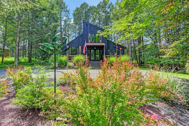 803 Deerfield Rd, Lake Ariel, PA 18436 - rear view of house with french doors and board and batten siding