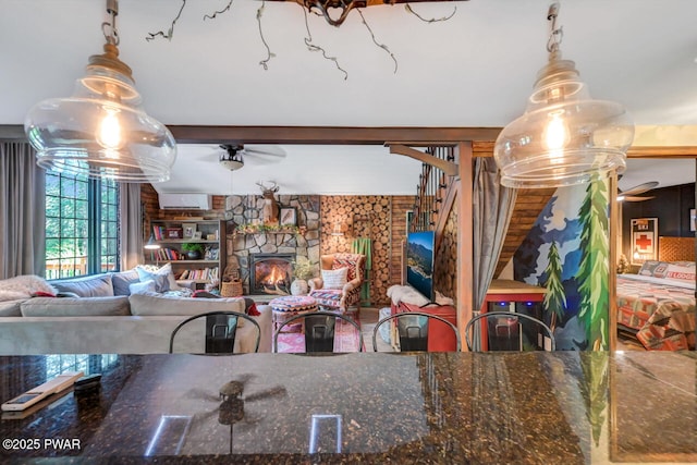 803 Deerfield Rd, Lake Ariel, PA 18436 - dining space featuring a ceiling fan and a stone fireplace