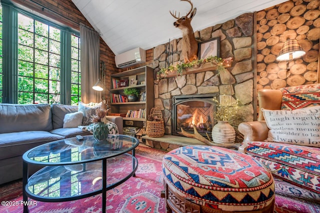 803 Deerfield Rd, Lake Ariel, PA 18436 - living area featuring an AC wall unit, lofted ceiling, wood finished floors, and a fireplace