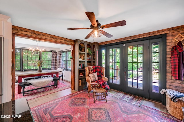 803 Deerfield Rd, Lake Ariel, PA 18436 - living area with wood finished floors, french doors, a chandelier, and ceiling fan