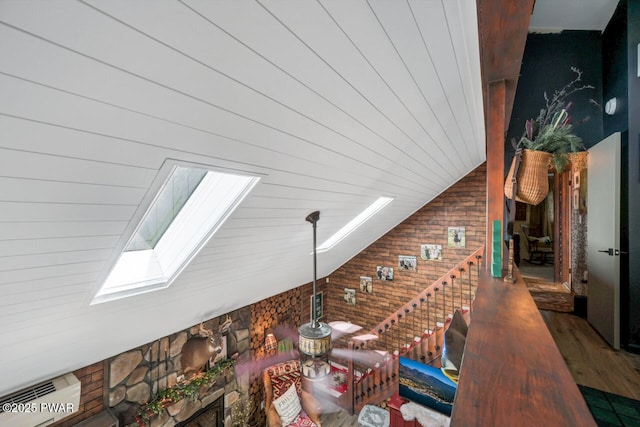 803 Deerfield Rd, Lake Ariel, PA 18436 - additional living space with a skylight, wood finished floors, and lofted ceiling