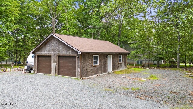141 Constitution Dr, Lackawaxen, PA 18435 - detached garage featuring view of scattered trees