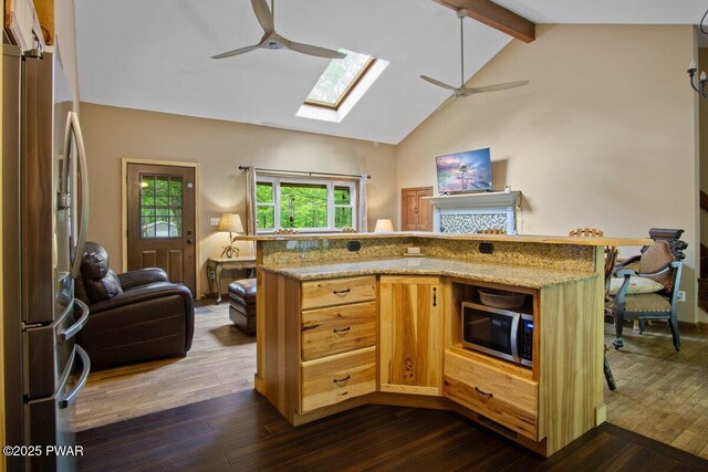 141 Constitution Dr, Lackawaxen, PA 18435 - kitchen with ceiling fan, stainless steel appliances, a skylight, beam ceiling, and open floor plan