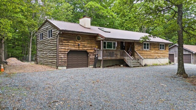 141 Constitution Dr, Lackawaxen, PA 18435 - rustic home featuring covered porch, a chimney, metal roof, and gravel driveway