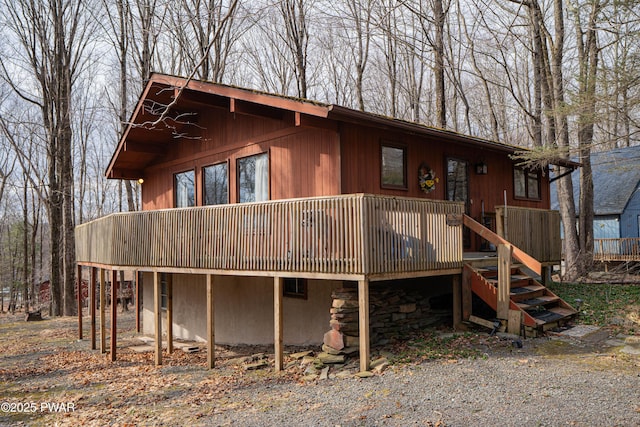 back of house with stairway and a deck