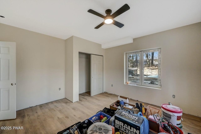 unfurnished bedroom with ceiling fan, light hardwood / wood-style floors, and a closet