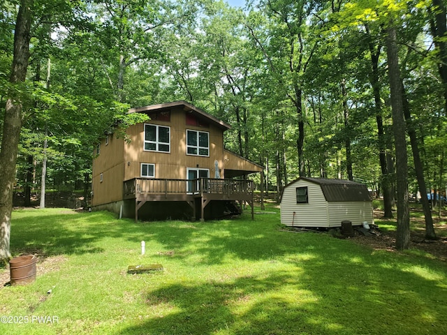 188 Forest Ridge Dr, Hawley, PA 18428 - rear view of house featuring a storage unit, a deck, and a yard