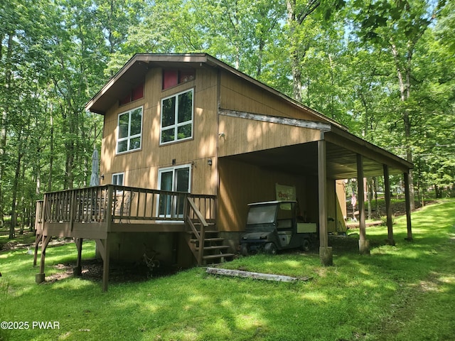 188 Forest Ridge Dr, Hawley, PA 18428 - rear view of property featuring a lawn and a deck