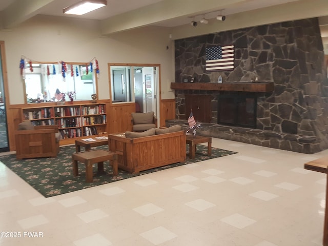 188 Forest Ridge Dr, Hawley, PA 18428 - living room featuring a stone fireplace and tile patterned floors