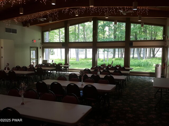 188 Forest Ridge Dr, Hawley, PA 18428 - dining space with carpet floors and a high ceiling