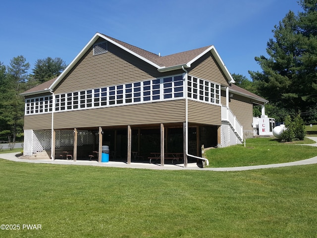 188 Forest Ridge Dr, Hawley, PA 18428 - back of house featuring a patio and a lawn