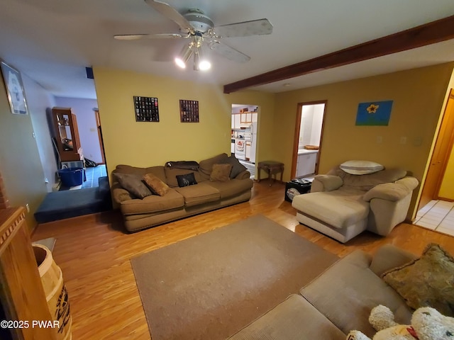 188 Forest Ridge Dr, Hawley, PA 18428 - living room featuring light wood-type flooring, a ceiling fan, and beam ceiling
