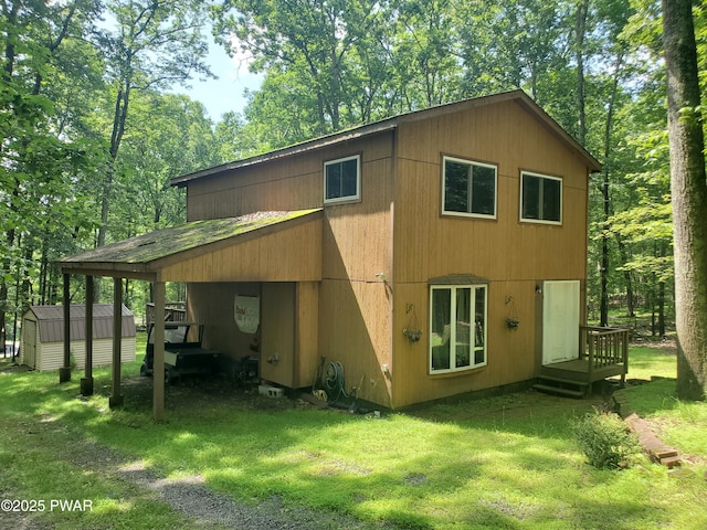 188 Forest Ridge Dr, Hawley, PA 18428 - back of property with a lawn and a shed